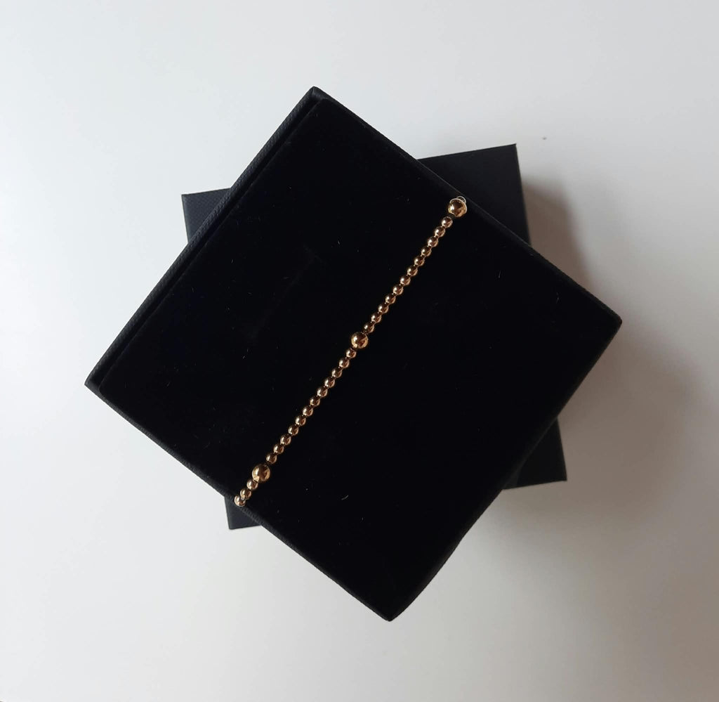 Stretch armband gouden kralen