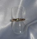 Gedraaide ring met strass steen