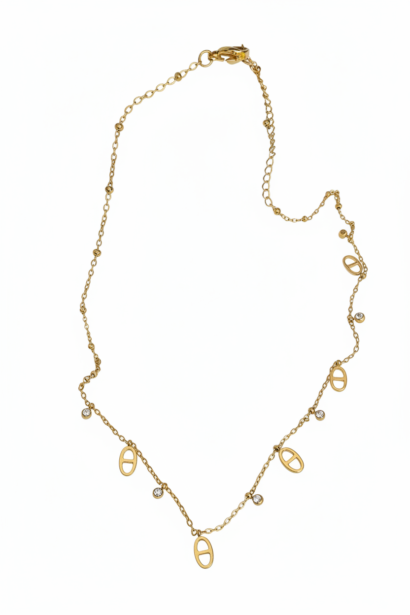 Korte ketting met link bedels en strass goud witte achtergrond