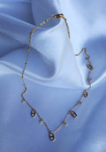 Korte ketting met link bedels en strass