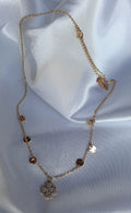 Korte ketting strass bloem en fijne muntjes